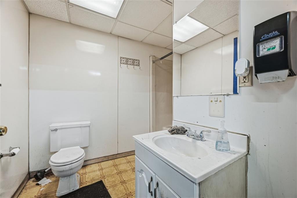 4225 Main Street Pittsburgh, PA 15224 - Photo 18 of 30 a bathroom with a toilet sink and mirror