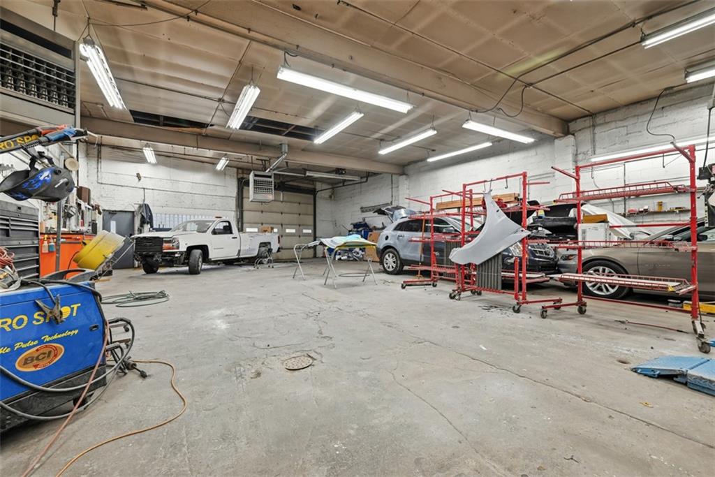 4225 Main Street Pittsburgh, PA 15224 - Photo 26 of 30 a view of parking garage with cars