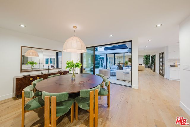 a dining room with furniture a livingroom and chandelier