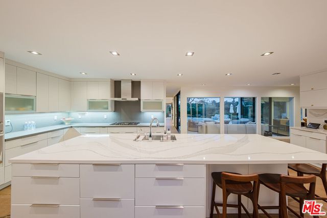 a kitchen with a table and chairs in it