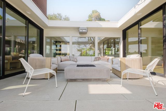 a view of a terrace with furniture
