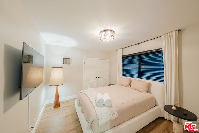 a bathroom with a sink toilet a mirror and shower