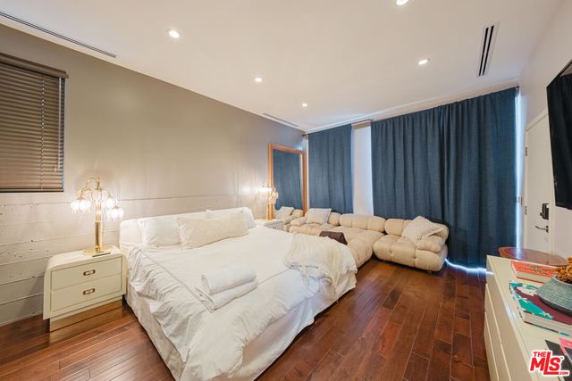a view of a balcony with wooden chairs