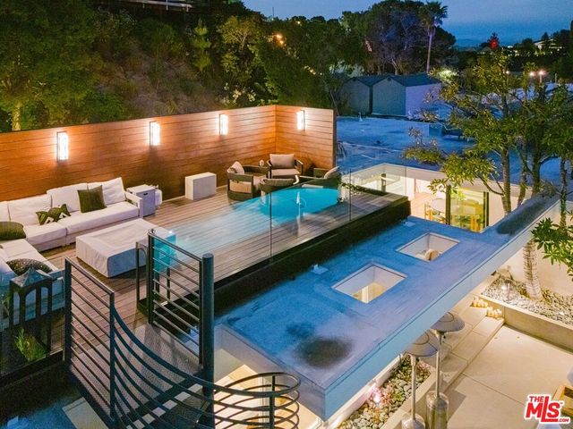 a view of a chairs and table in patio