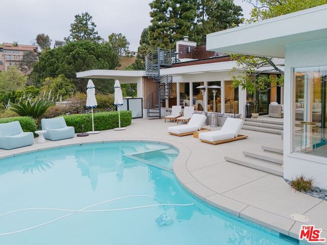 a view of a house with backyard porch and patio