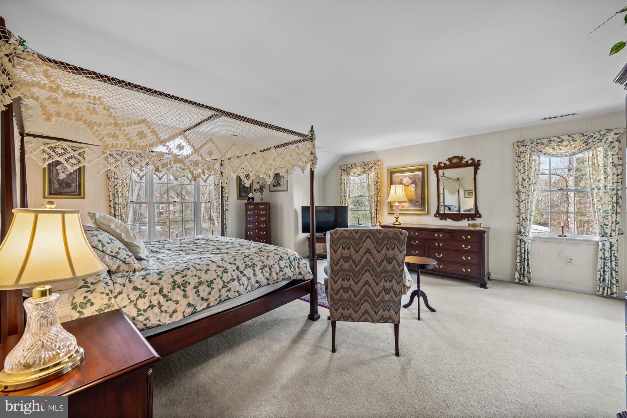 4 Independence Way Southampton, NJ 08088 - Photo 17 of 25 a bedroom with a bed a table and chair