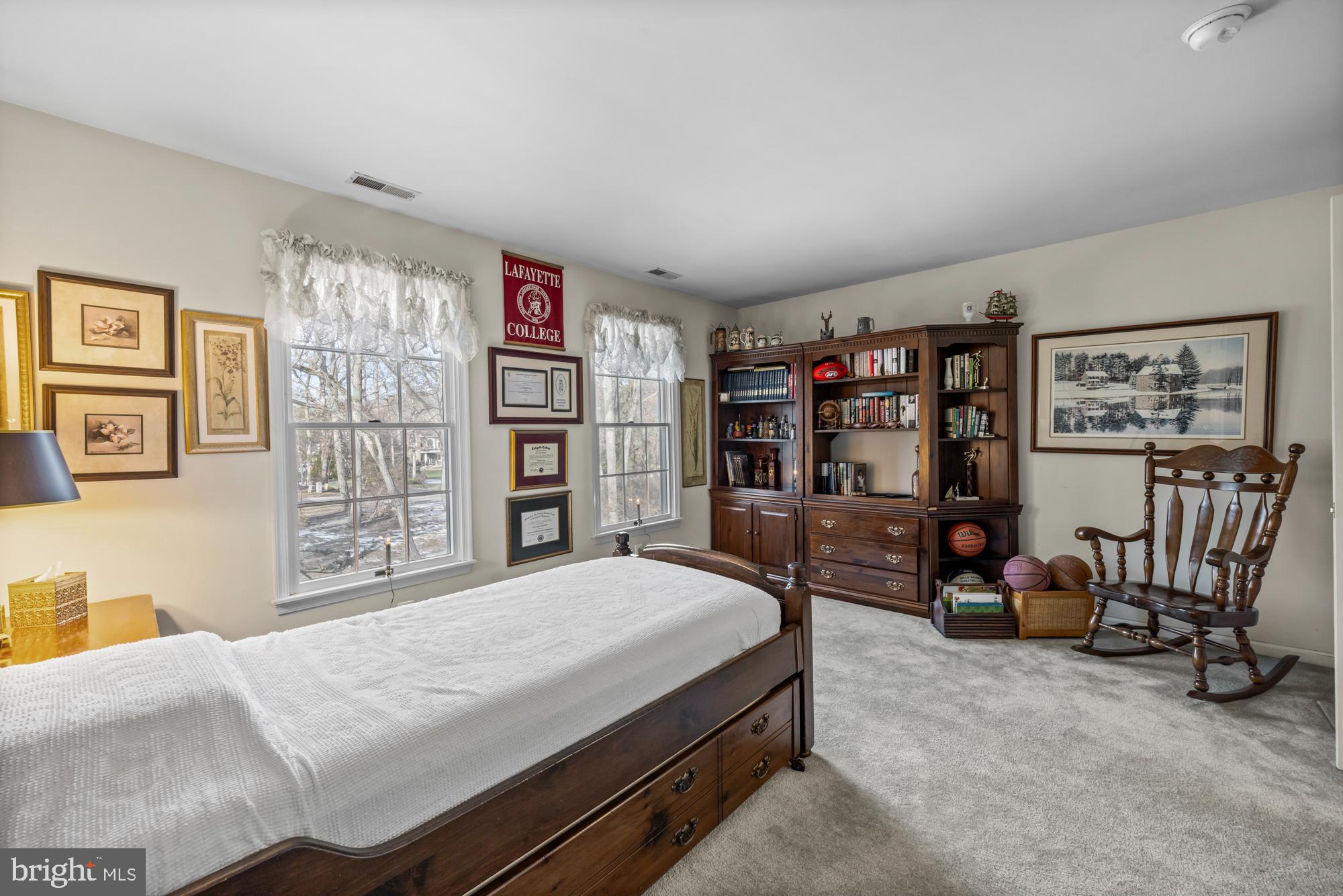 4 Independence Way Southampton, NJ 08088 - Photo 18 of 25 a bedroom with a bed a study table and large window
