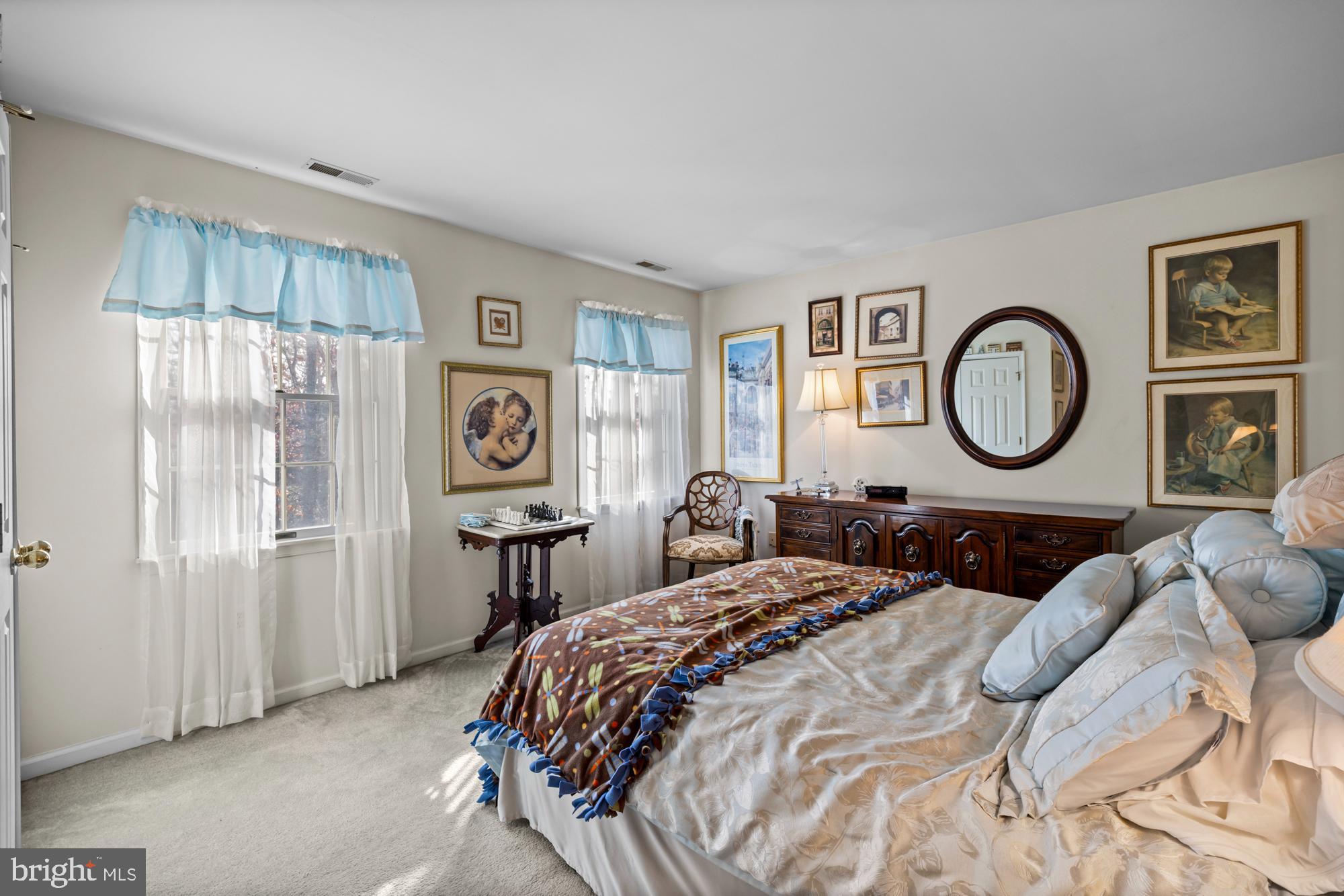 4 Independence Way Southampton, NJ 08088 - Photo 19 of 25 a bedroom with a bed and a lamp