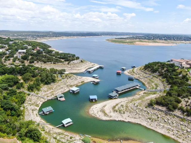 an aerial view of a houses with ocean view