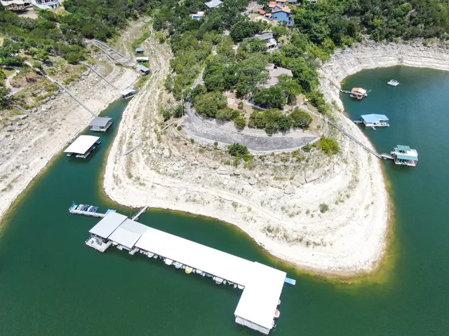 a view of a swimming pool with a yard