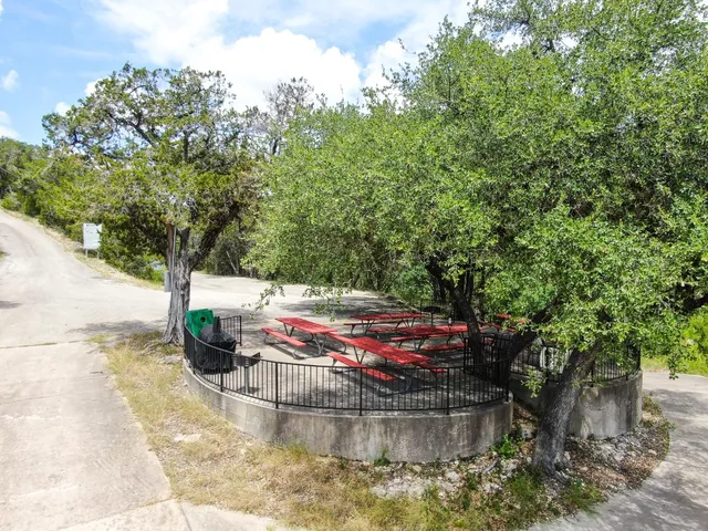 a view of a water fountain in the backyard of house