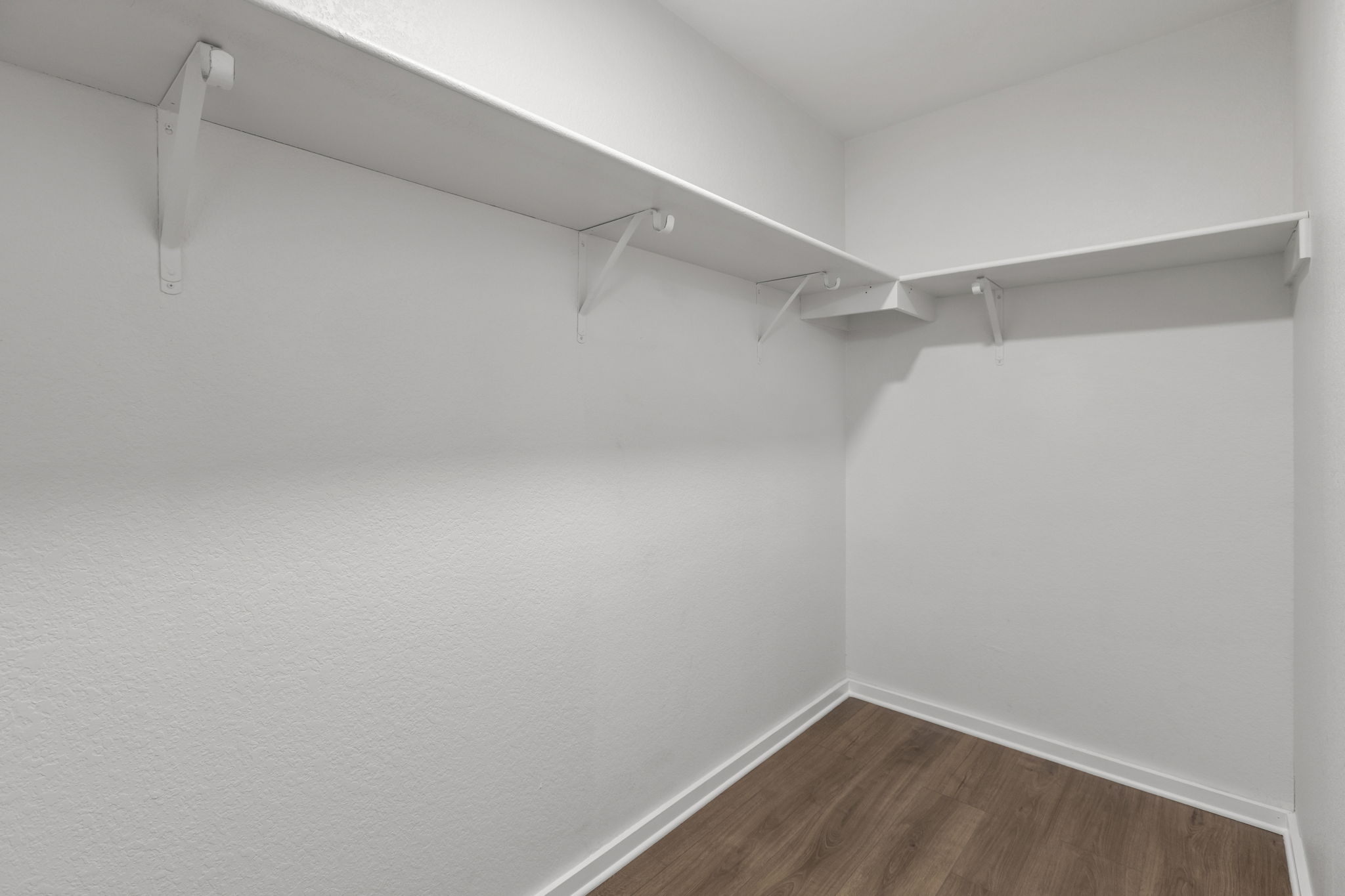 2110 Nogales Trail Austin, TX 78744 - Photo 24 of 36 Spacious closet featuring wood-style floors