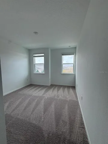 a view of an empty room and window