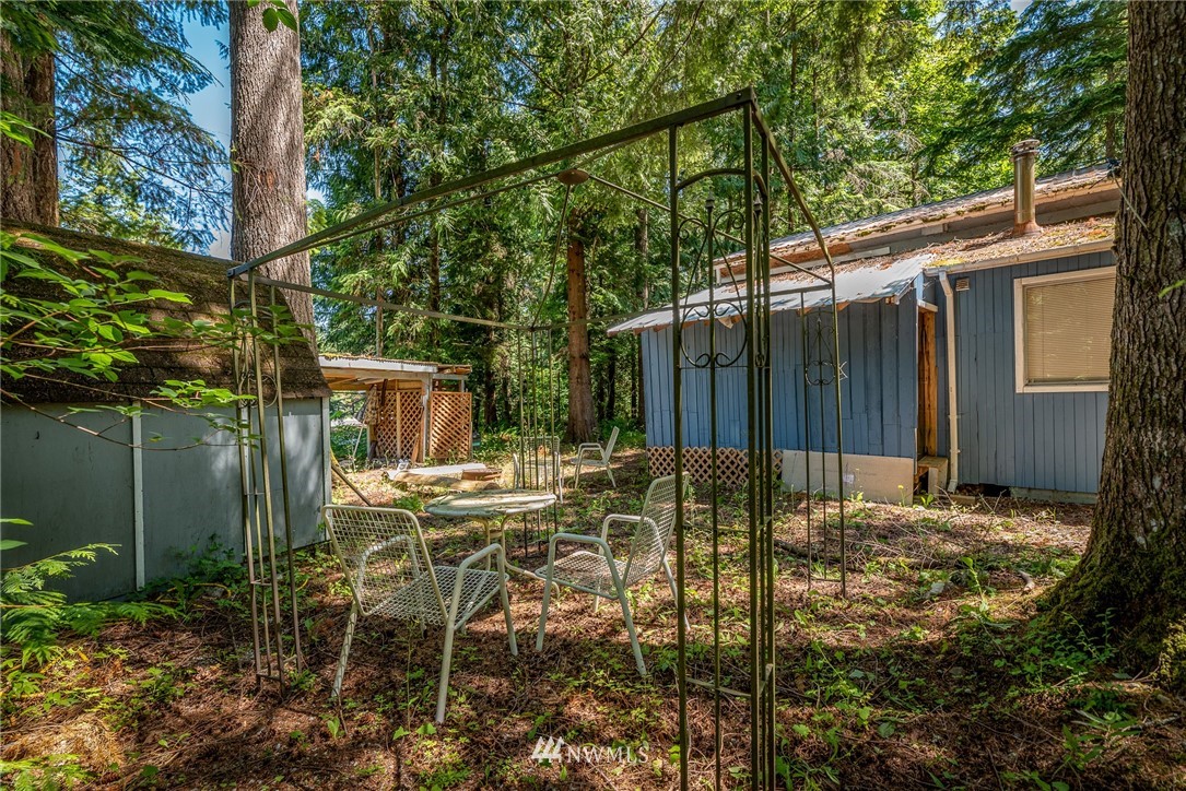 3031 Tower Road Maple Falls, WA 98266 - Photo 20 of 22 a backyard of a house with table and chairs