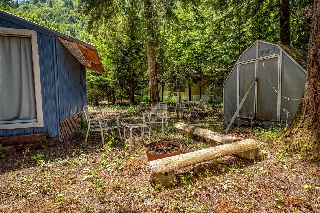 3031 Tower Road Maple Falls, WA 98266 - Photo 21 of 22 a backyard of a house with table and chairs
