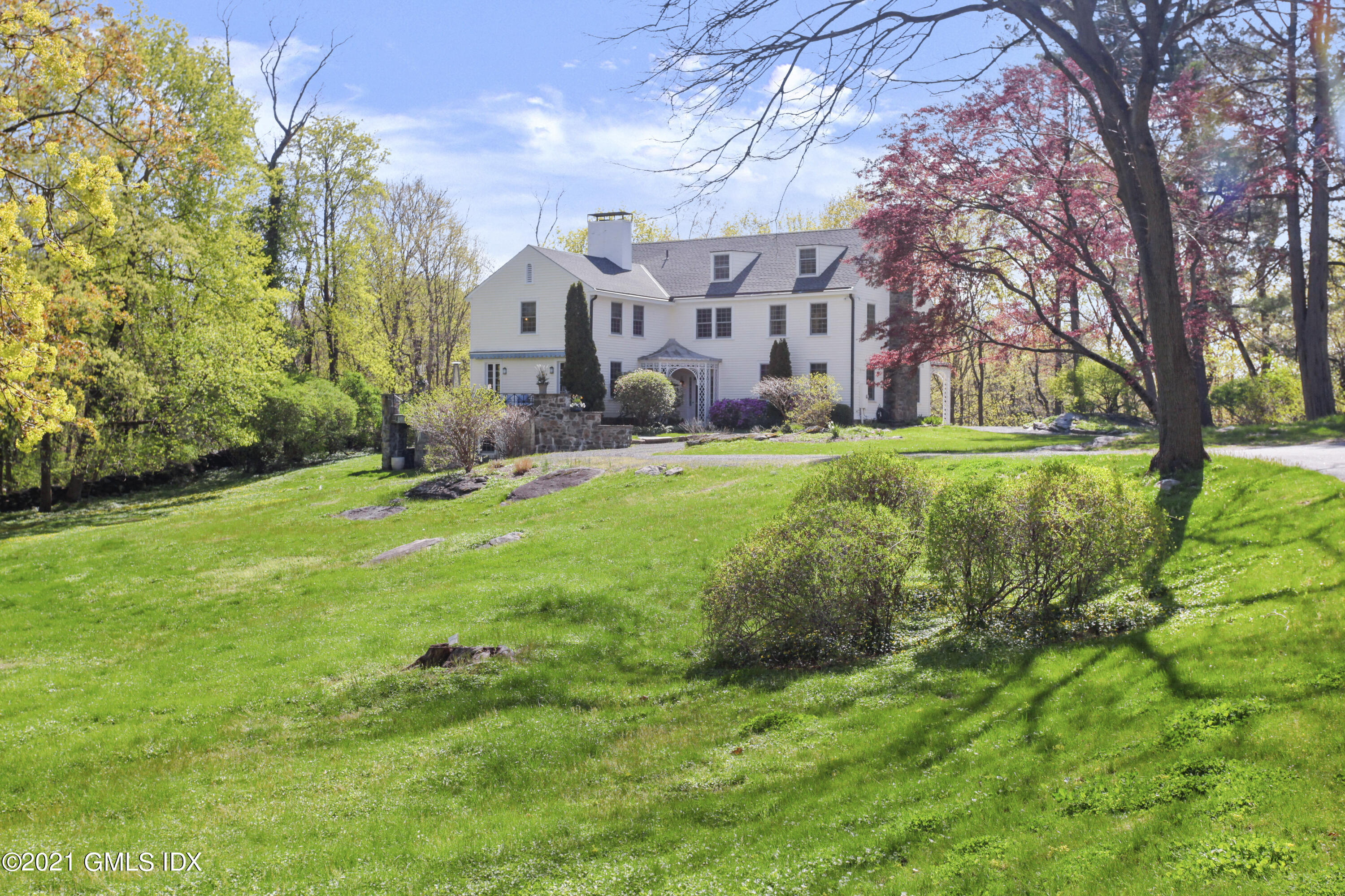 75 Calhoun Drive Greenwich, CT 06831 - Photo 23 of 25 a large building with trees in front of it
