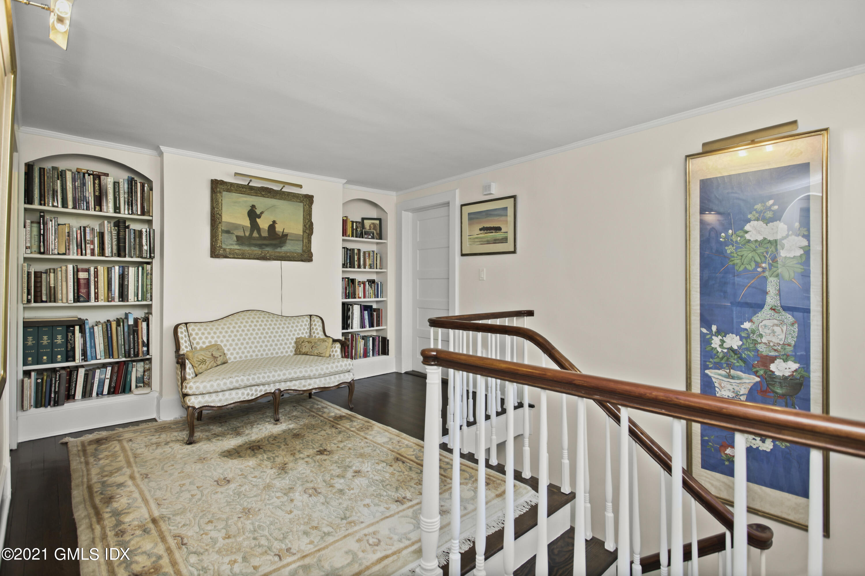 75 Calhoun Drive Greenwich, CT 06831 - Photo 10 of 25 a living room with furniture window and book shelf
