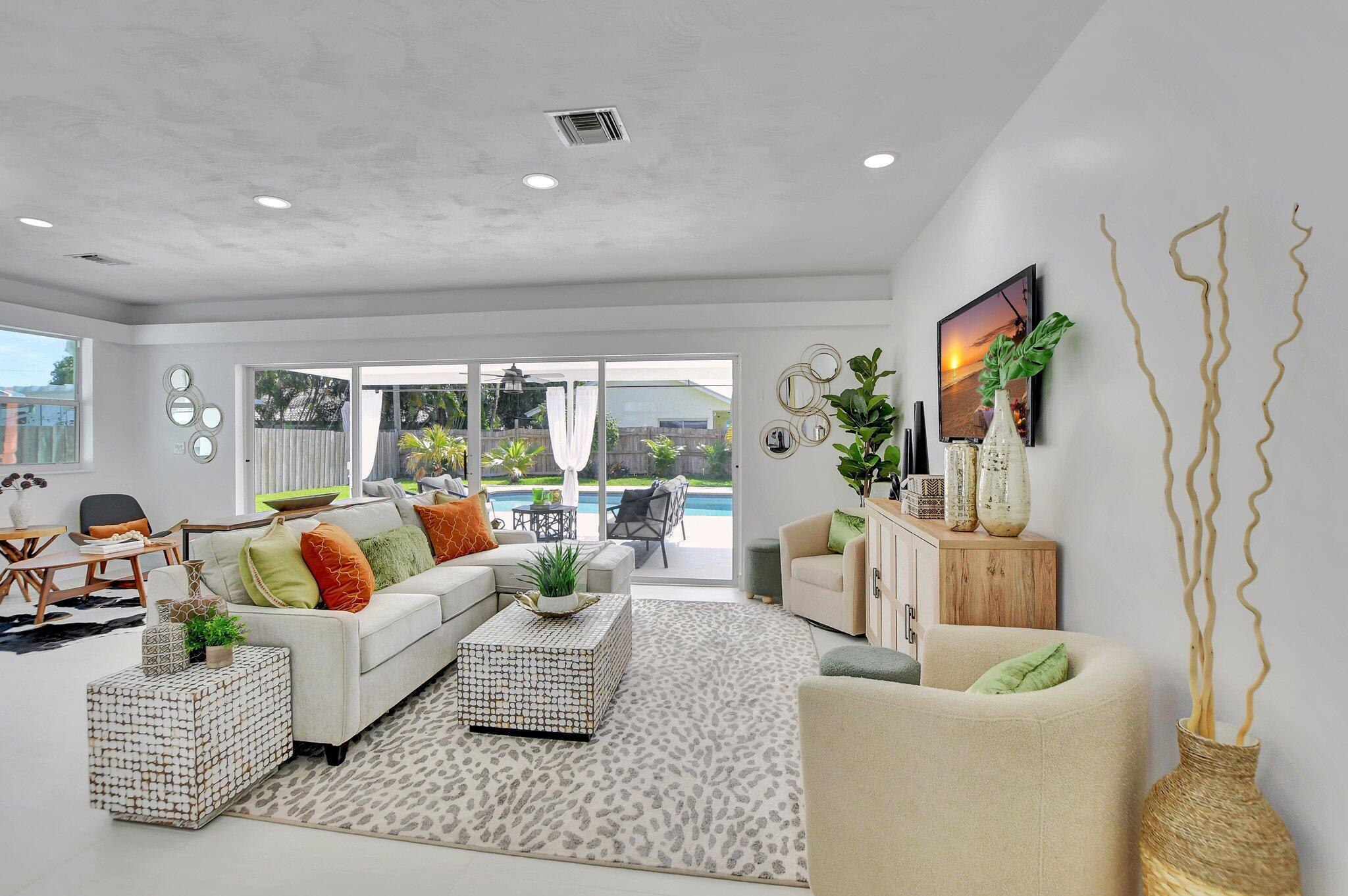 832 Southwest 10th Avenue Boca Raton, FL 33486 - Photo 12 of 57 a living room with furniture and a large window