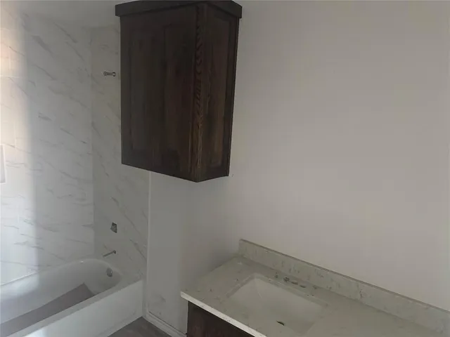 a bathroom with a sink and a bathtub
