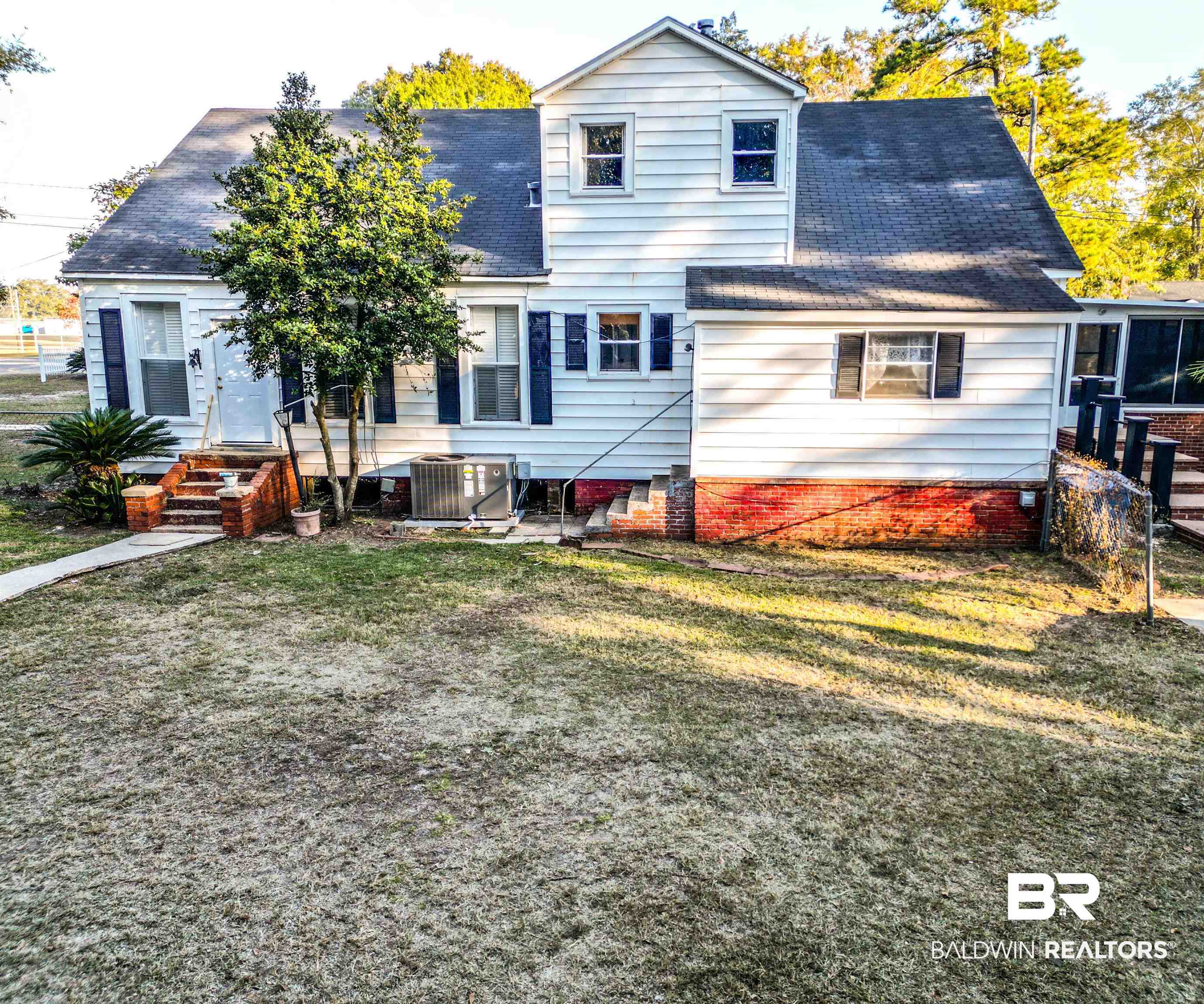 73 Liberty Street Monroeville, AL 36460 - Photo 2 of 29 Rear view of property featuring central AC and a yard