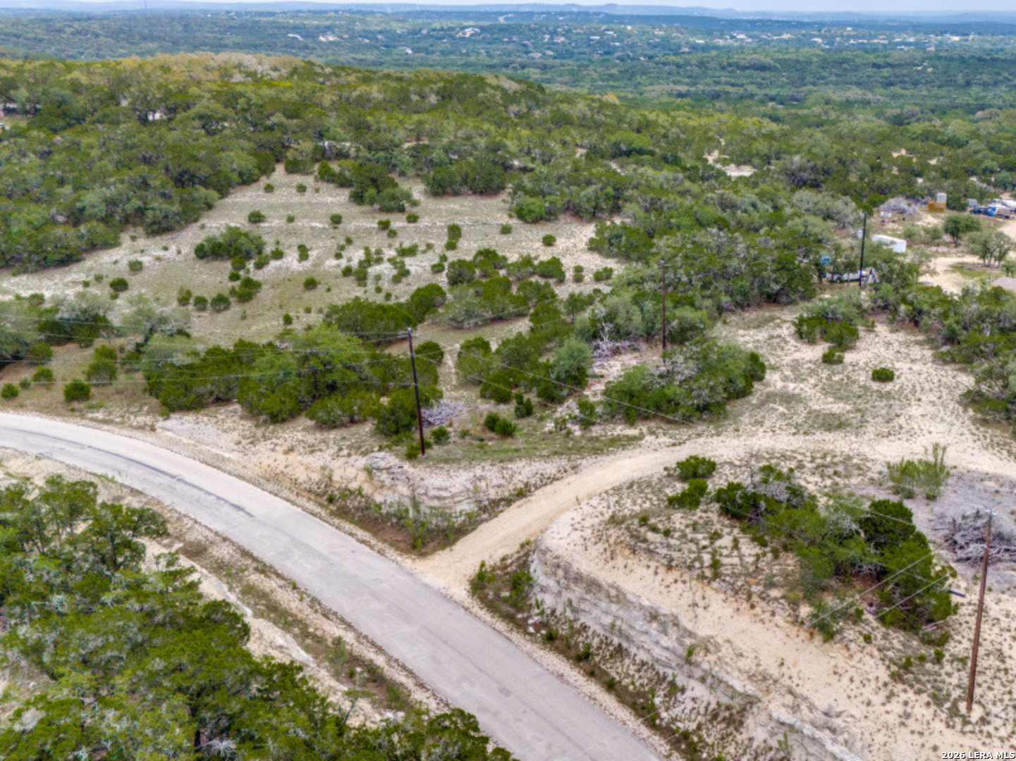 1578 Primrose Path Spring Branch, TX 78070 - Photo 4 of 10 a view of a yard with a wooden bridge