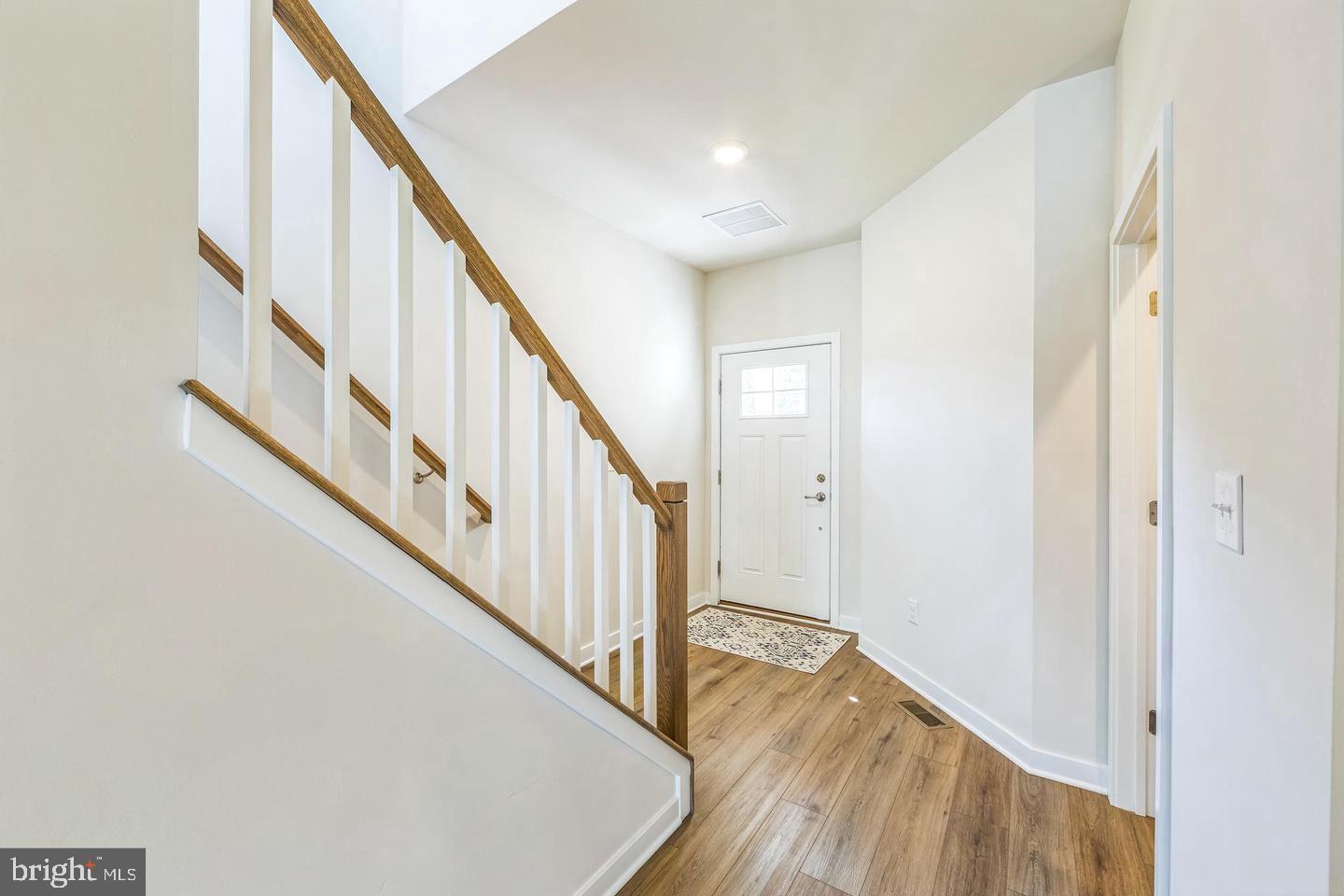 727 Hunsberger Road Spring City, PA 19475 - Photo 3 of 32 a view of staircase with wooden floor and white walls
