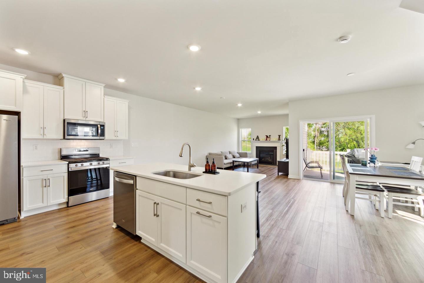 727 Hunsberger Road Spring City, PA 19475 - Photo 6 of 32 a kitchen with stainless steel appliances granite countertop a lot of counter space and wooden floors