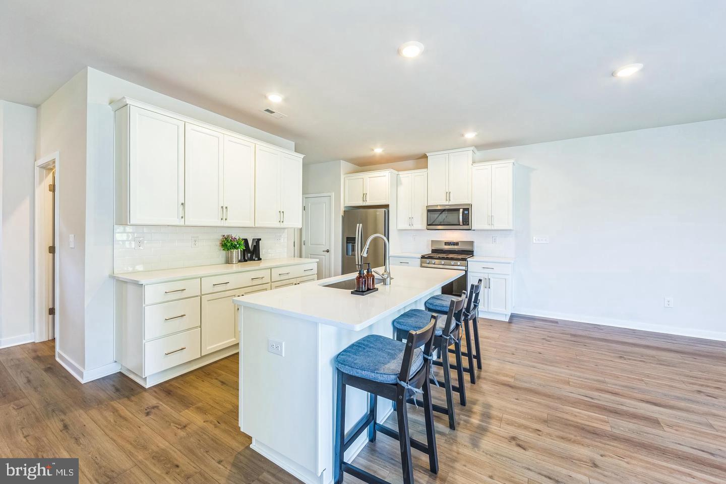 727 Hunsberger Road Spring City, PA 19475 - Photo 9 of 32 a kitchen with a dining table chairs appliances and cabinets