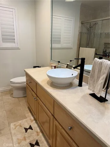 a bedroom with a bed and a cabinets