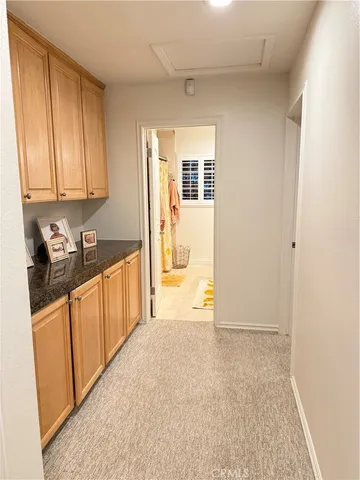 a view of a chair and table on the roof deck