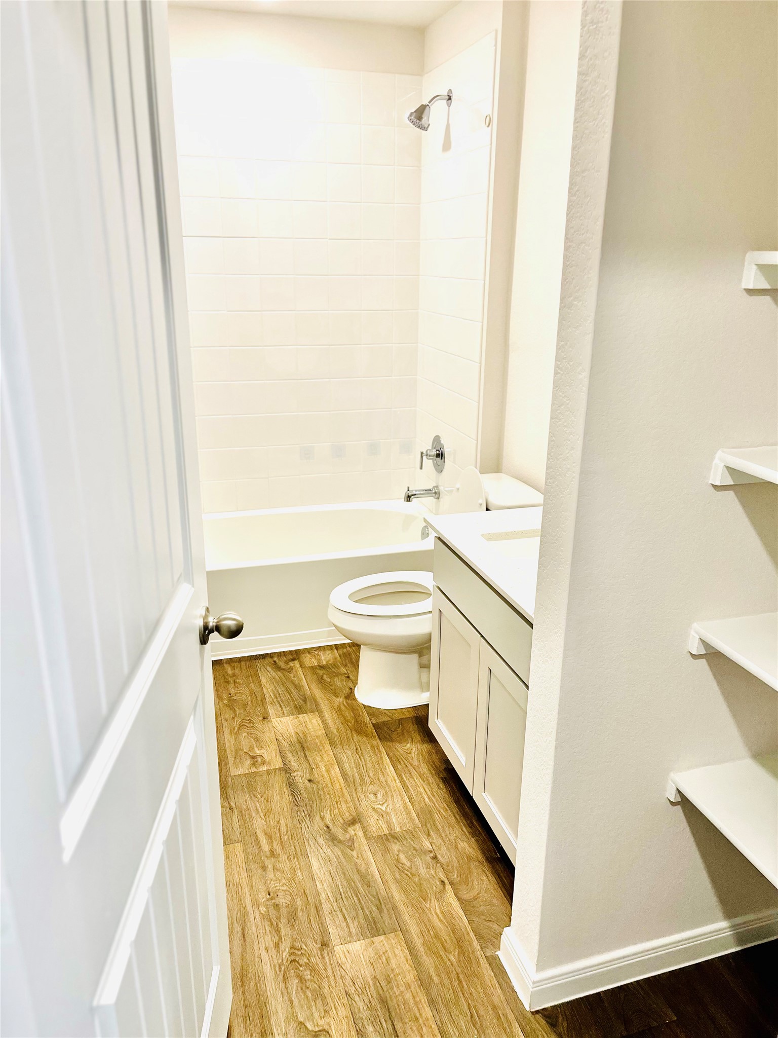 1420 London Way Lockhart, TX 78644 - Photo 4 of 12 a bathroom with a sink a toilet and shower