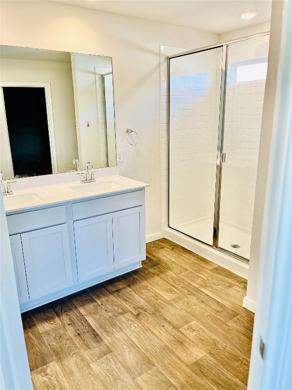 1420 London Way Lockhart, TX 78644 - Photo 10 of 12 a bathroom with a sink mirror and a shower