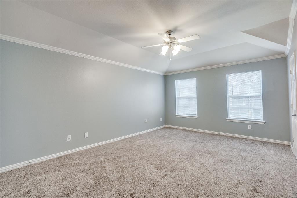 8738 Manhattan Avenue Plano, TX 75024 - Photo 14 of 22 an empty room with windows and fan