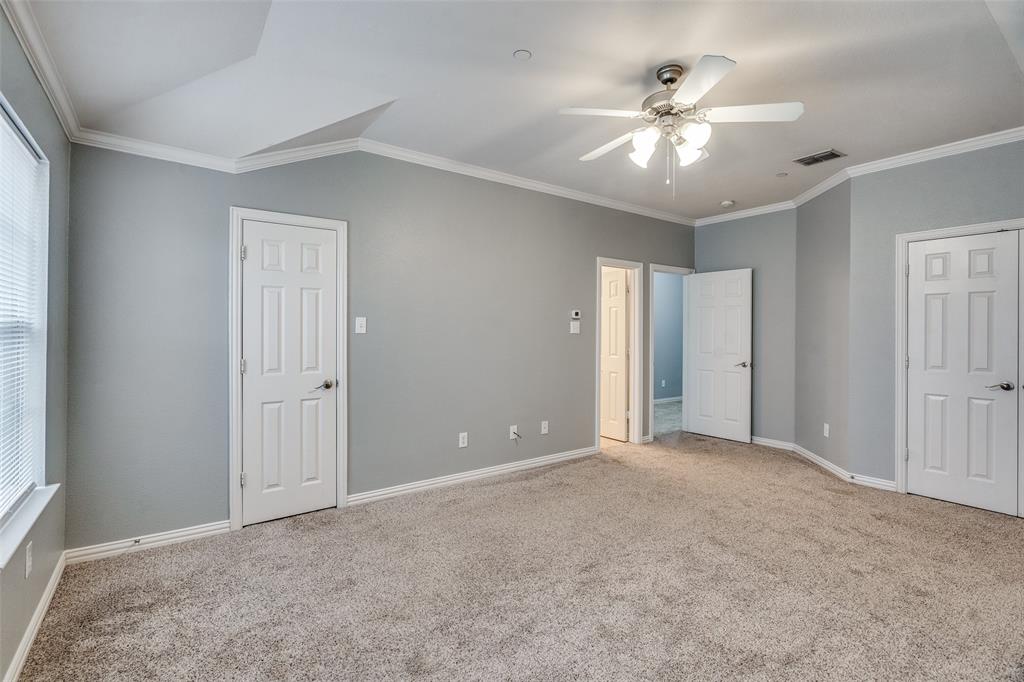 8738 Manhattan Avenue Plano, TX 75024 - Photo 16 of 22 a view of an empty room with a ceiling fan