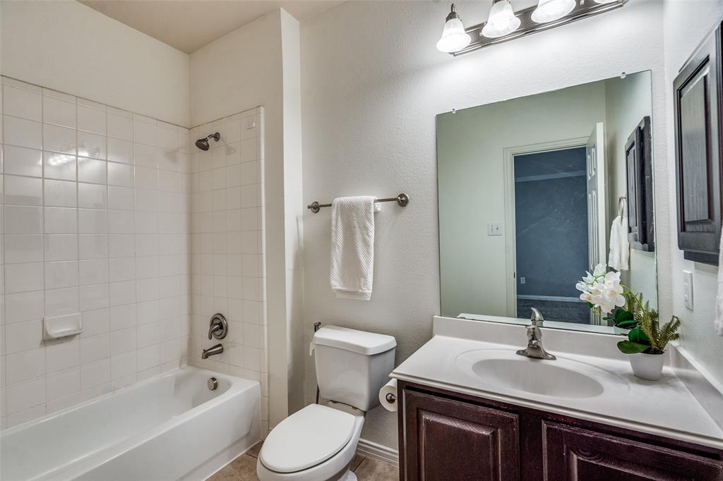 8738 Manhattan Avenue Plano, TX 75024 - Photo 19 of 22 a bathroom with a sink toilet and shower