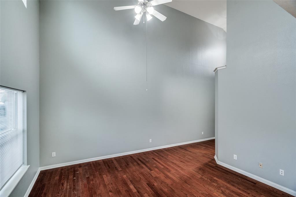 8738 Manhattan Avenue Plano, TX 75024 - Photo 5 of 22 an empty room with wooden floor and windows