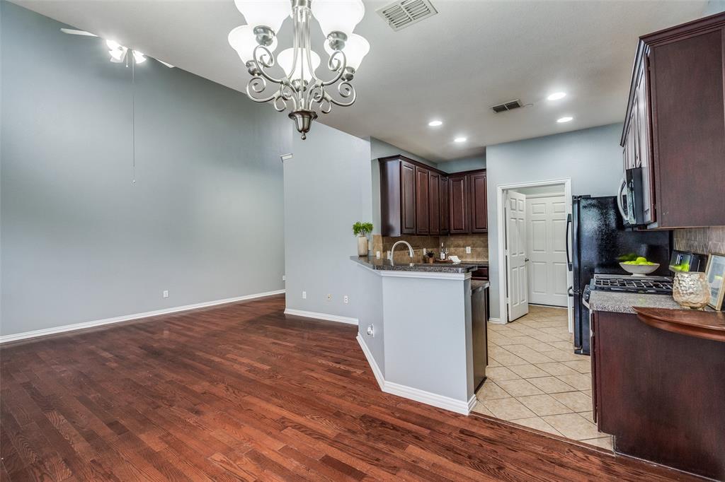 8738 Manhattan Avenue Plano, TX 75024 - Photo 8 of 22 a view of a kitchen with cabinets and stainless steel appliances