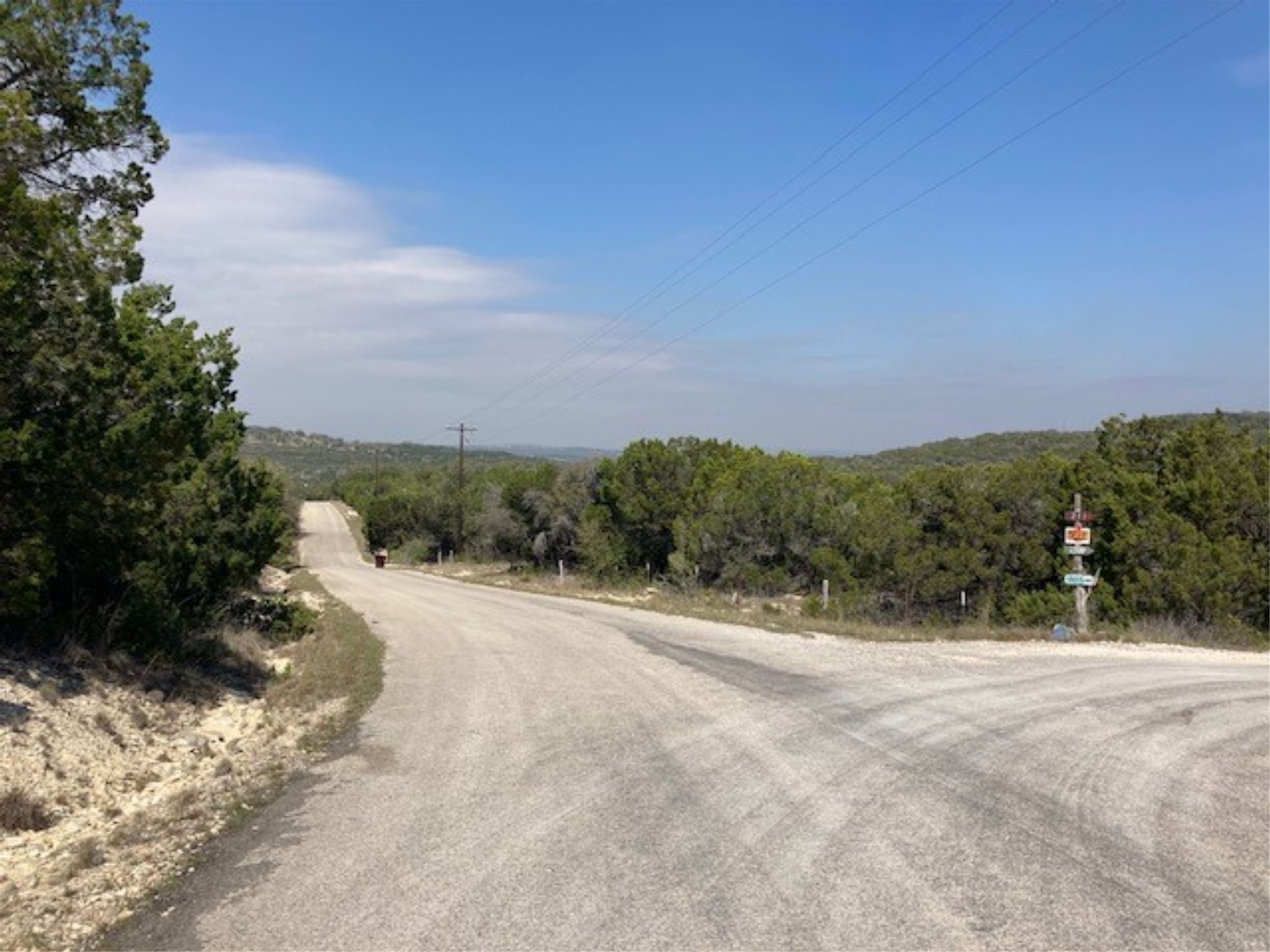1000 Norwood Road Dripping Springs, TX 78620 - Photo 18 of 22 a view of a road with a yard