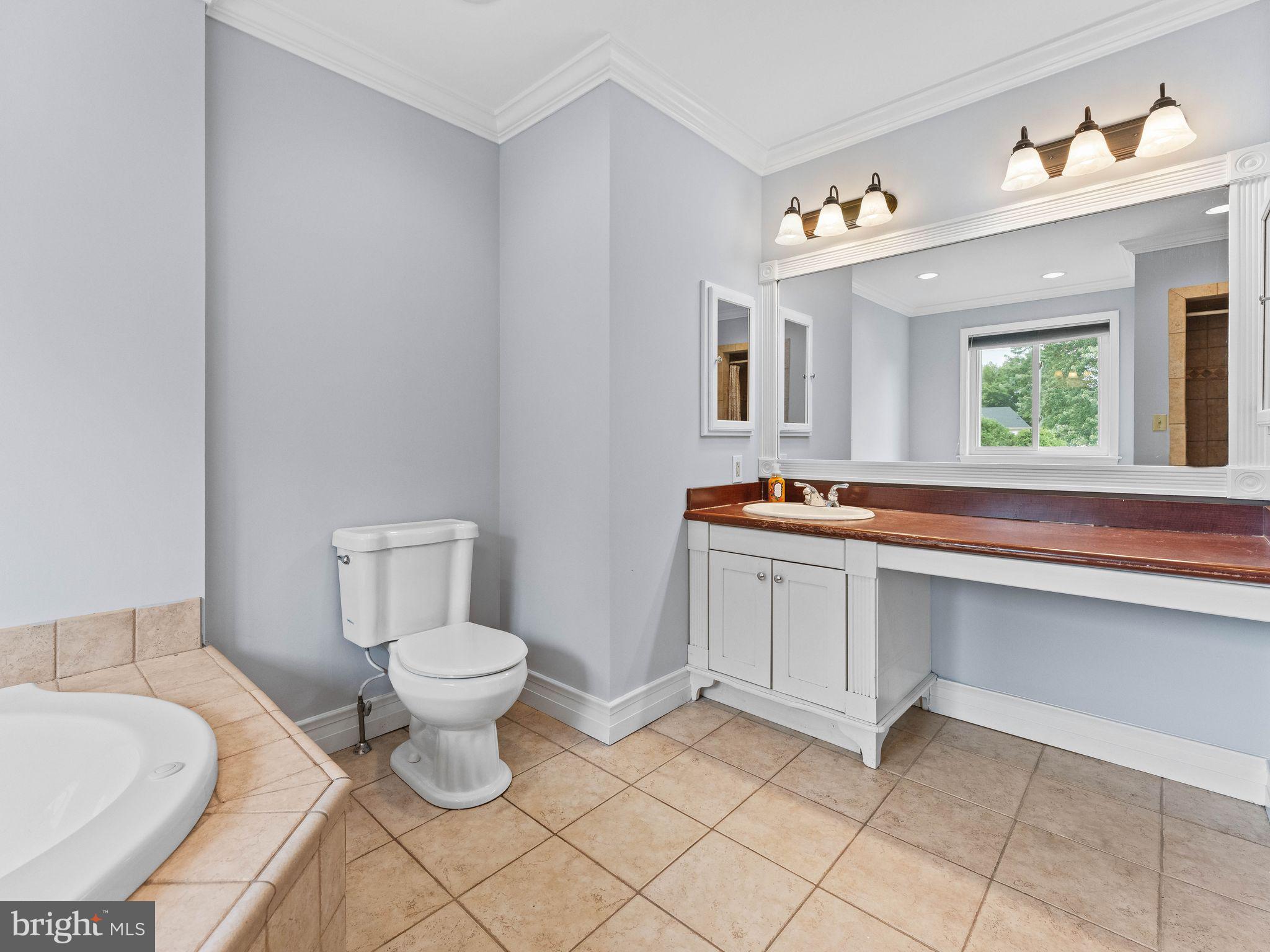 8 Chesterfield Road Sewell, NJ 08080 - Photo 26 of 57 a bathroom with a sink toilet and mirror