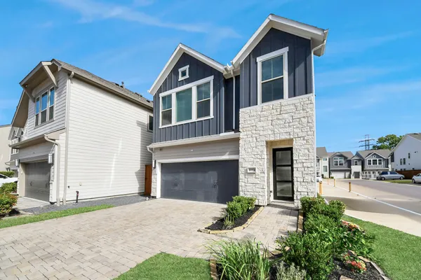 a front view of a house with yard