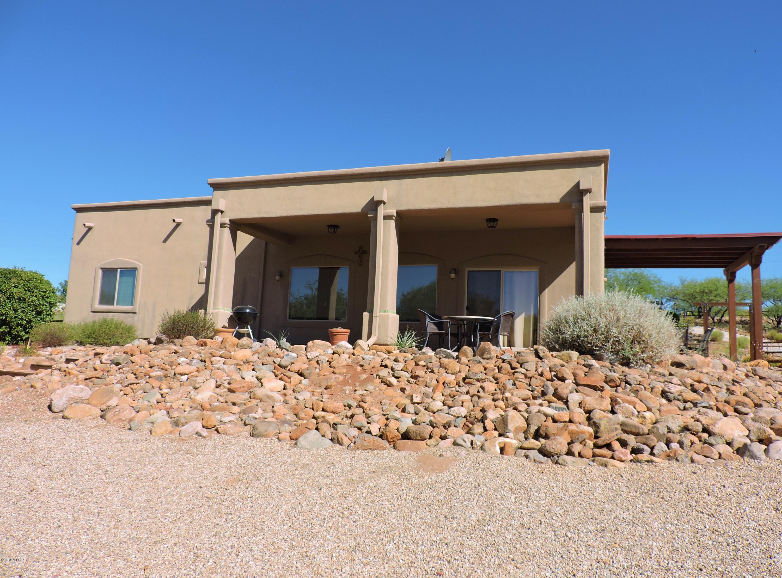 1786 Zimmer Court Rio Rico, AZ 85648 - Photo 9 of 42 a view of a house with a snow in the background