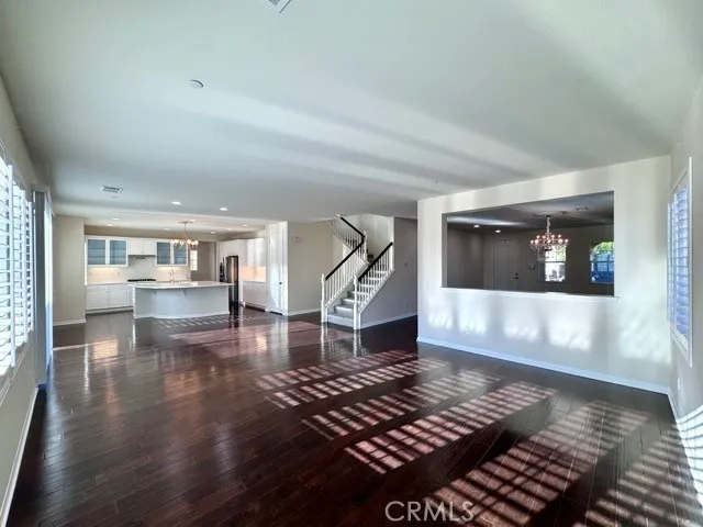 a large kitchen with kitchen island a sink stainless steel appliances and cabinets