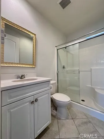 a view of staircase with wooden floor and fan