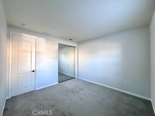 a view of empty room with windows