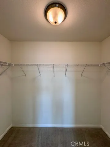 a view of an empty room with a closet