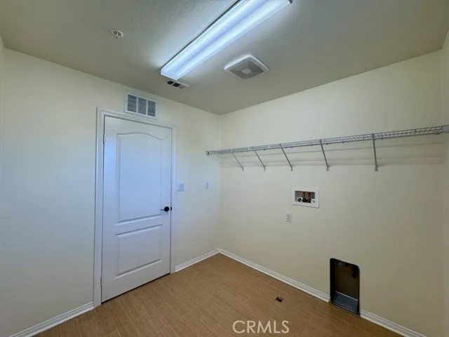 a spacious bathroom with a granite countertop sink a mirror and a bathtub