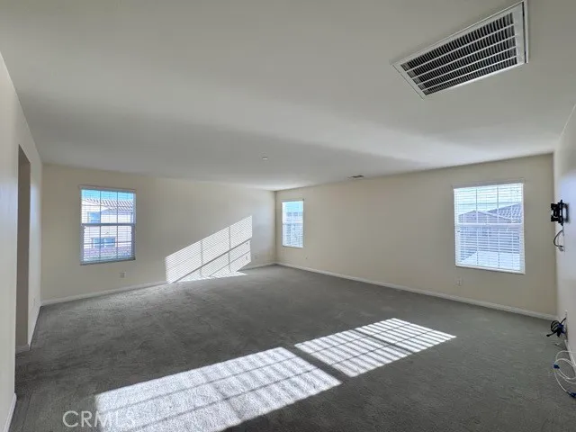 a view of room with wooden floor