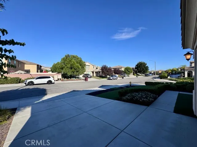 a street view with couple of cars parked on road