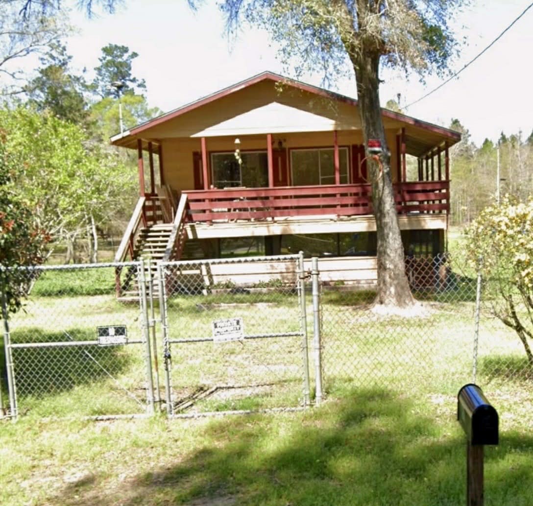 61 Hooker Shepherd, TX 77371 - Photo 2 of 17 a view of a house with a yard