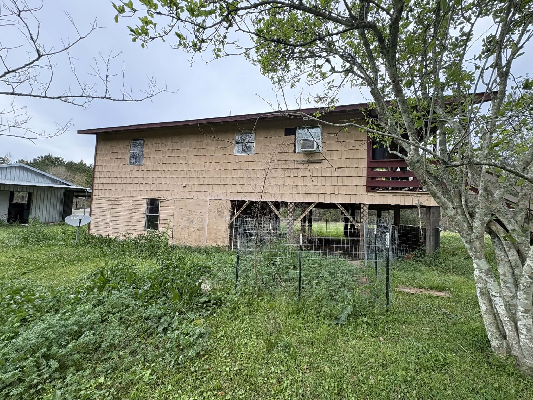 61 Hooker Shepherd, TX 77371 - Photo 4 of 17 a backyard of a house with lots of green space
